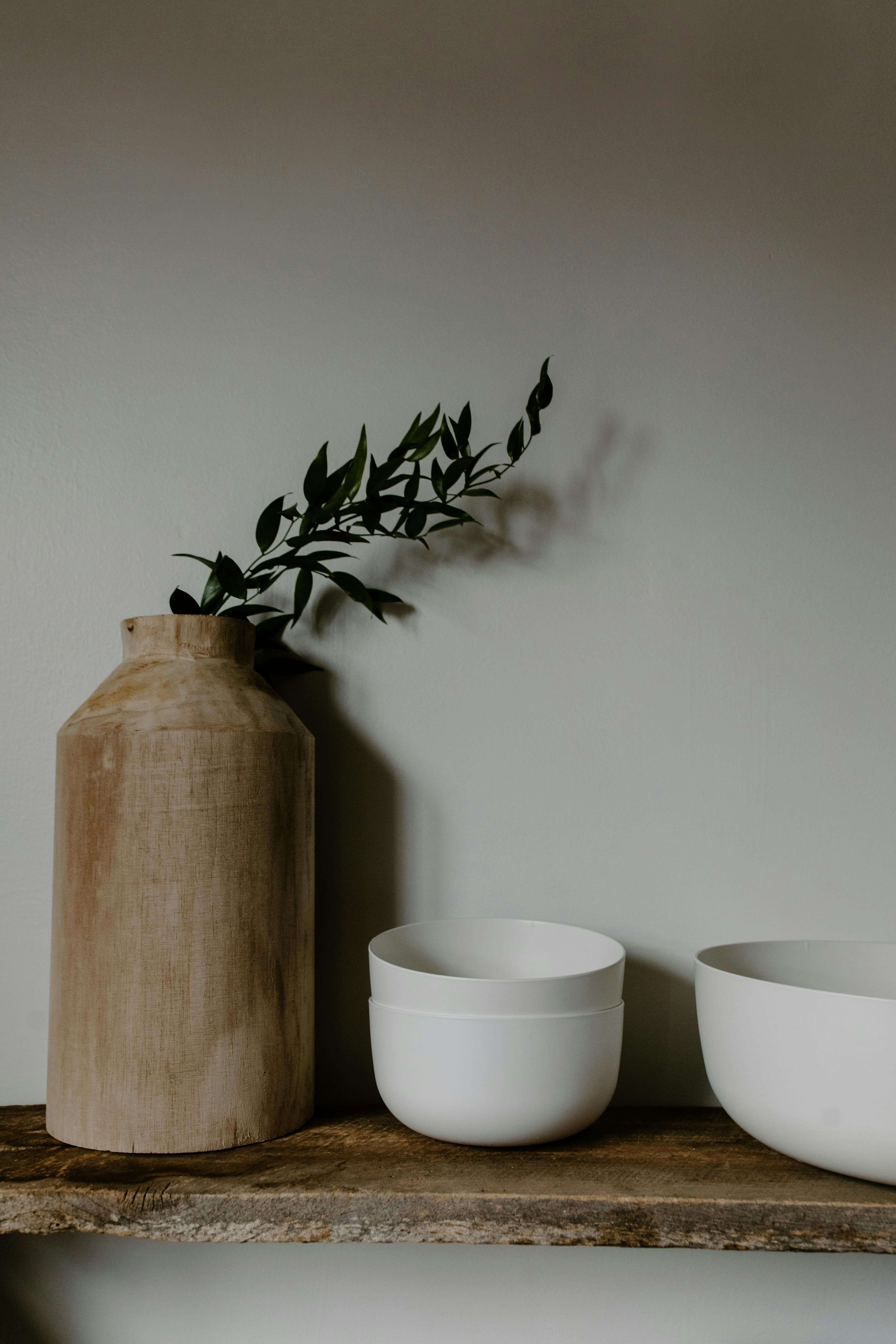 wooden vase and white bowls minimalist japandi style