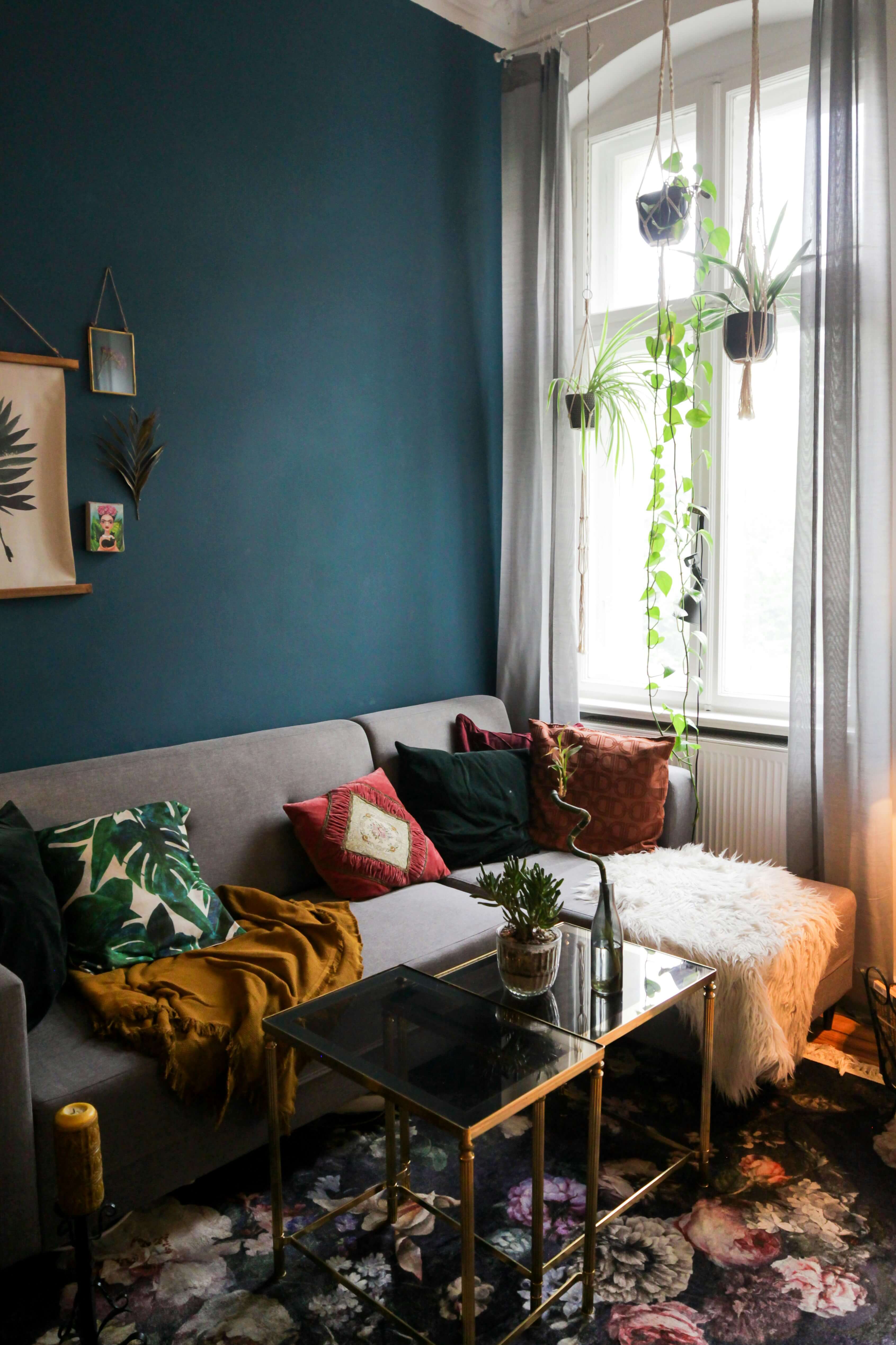 living room with different patterns and flower carpet