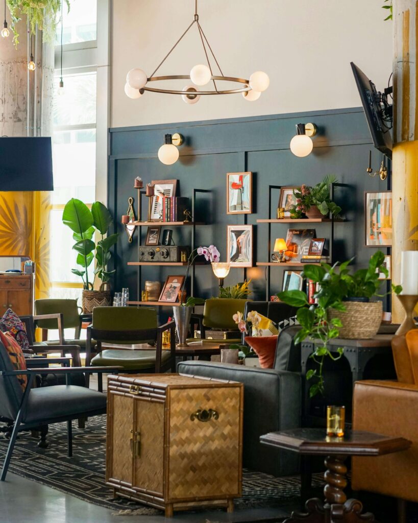 Mid Century Eclectic Living Room with dark green walls and golden lamps